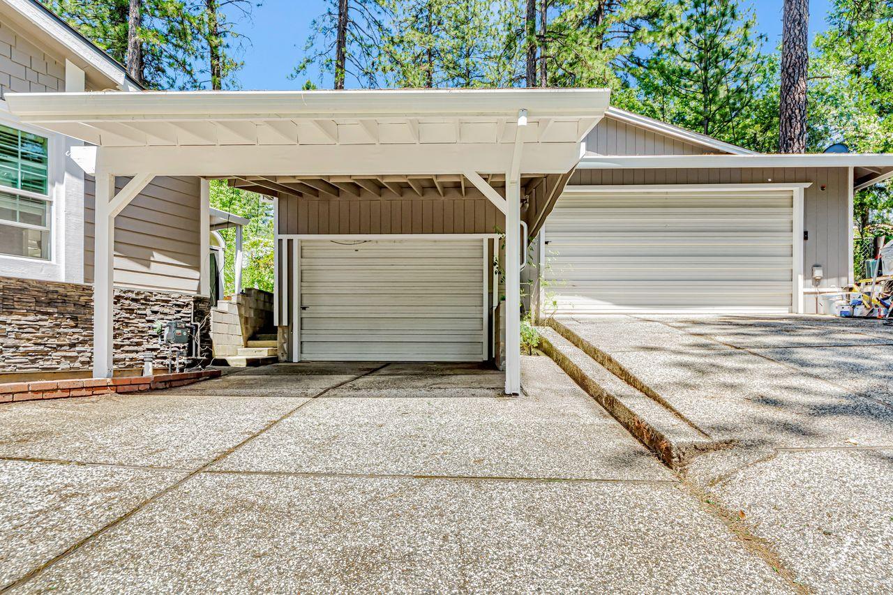571 B Lane Applegate, CA 95703 - Photo 7 of 85 a side view of a house with a garage