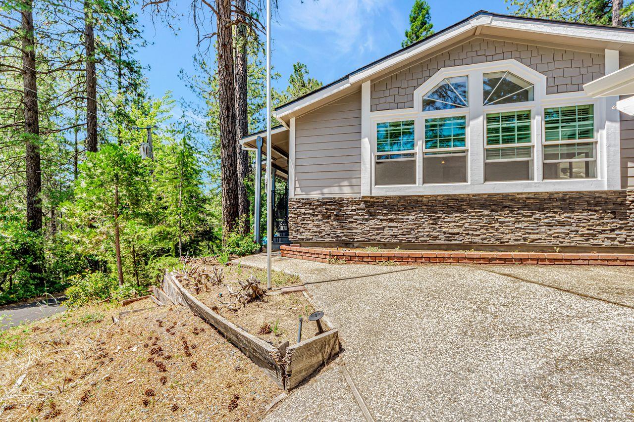 571 B Lane Applegate, CA 95703 - Photo 8 of 85 a front view of a house with a yard