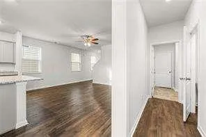 a view of a room with wooden floor and window