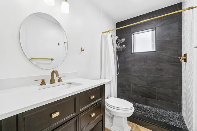 a living room with fireplace furniture and a wooden floor