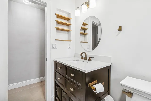 a room with lots of furniture and a chandelier