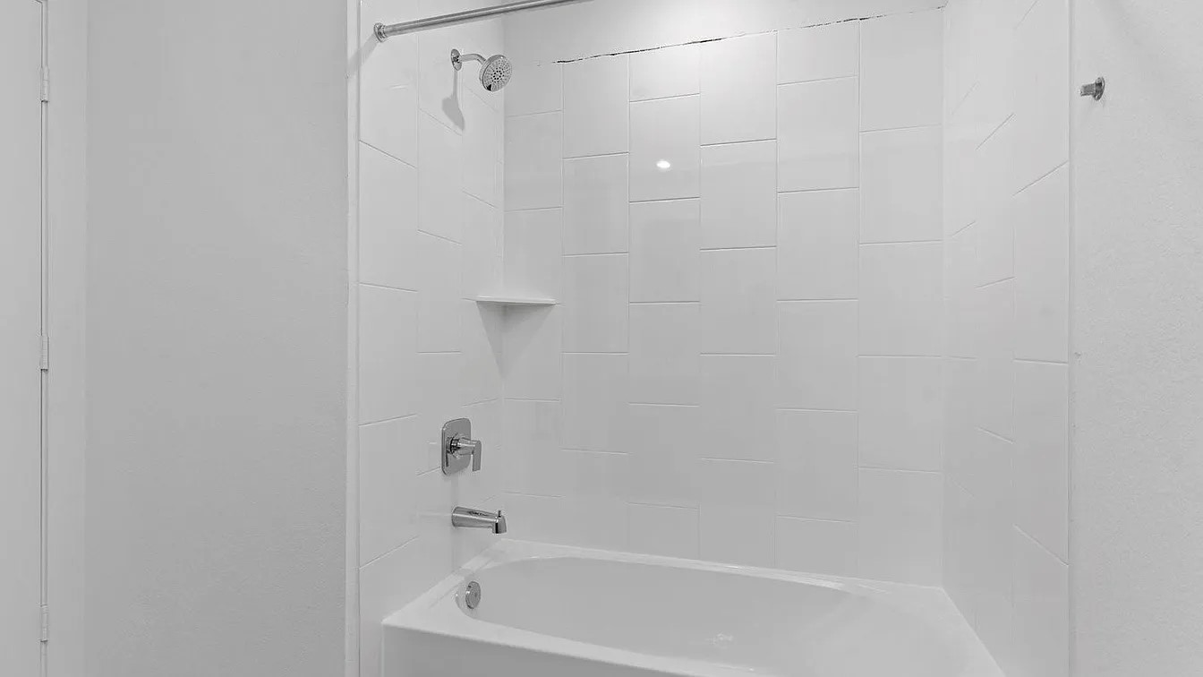 3702 Birtley Bnd Way Fulshear, TX 77441 - Photo 18 of 26 a bathroom with a bathtub