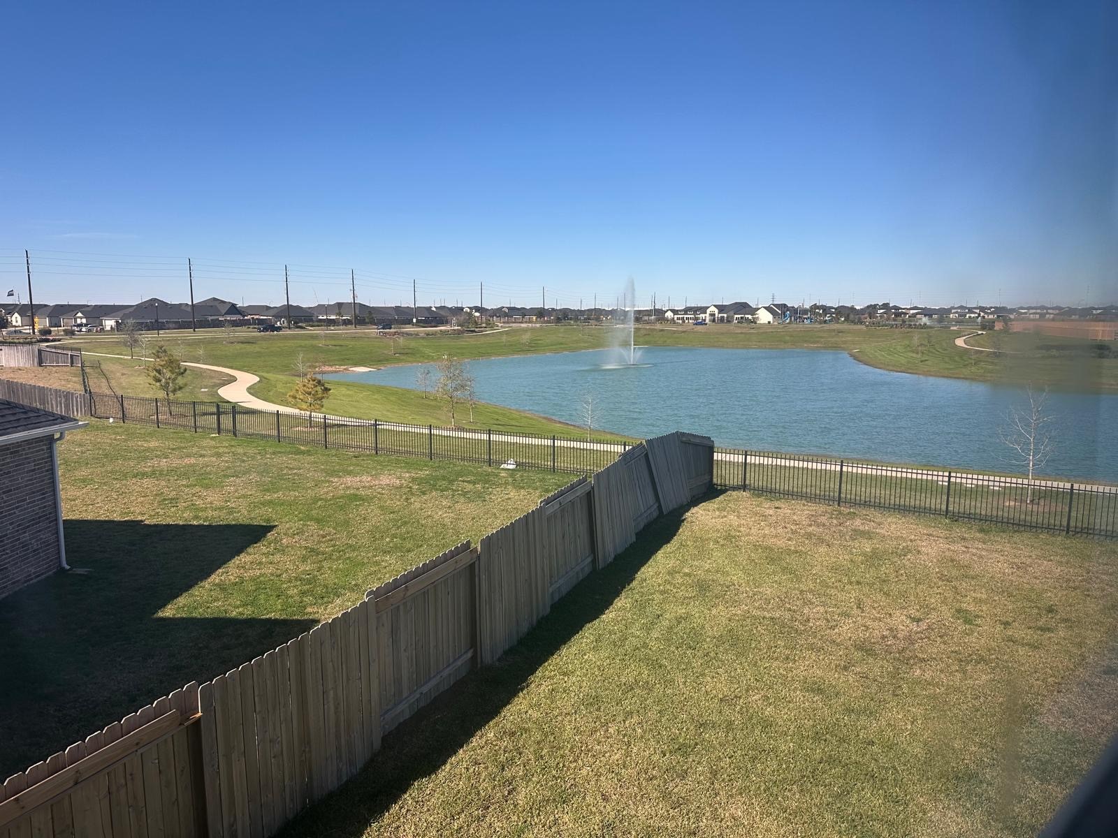 3702 Birtley Bnd Way Fulshear, TX 77441 - Photo 21 of 26 a view of a lake with a outdoor space