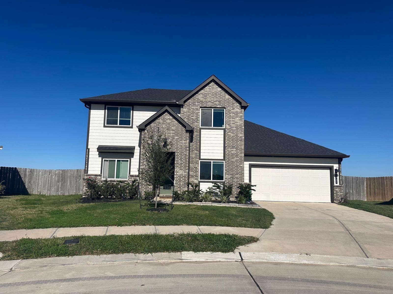 3702 Birtley Bnd Way Fulshear, TX 77441 - Photo 3 of 26 a front view of a house with a yard