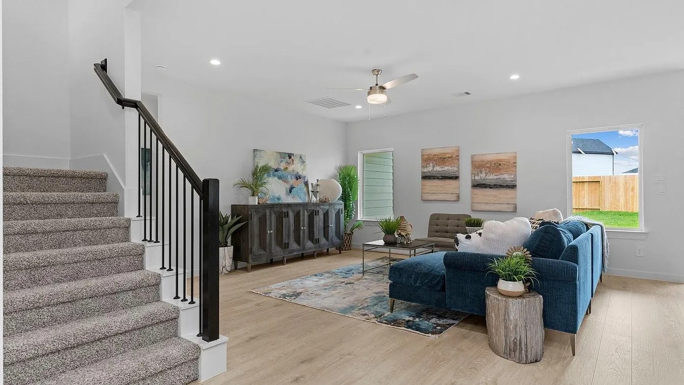 3702 Birtley Bnd Way Fulshear, TX 77441 - Photo 6 of 26 a living room with furniture and stairs