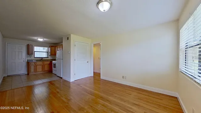 a view of kitchen and wooden floor