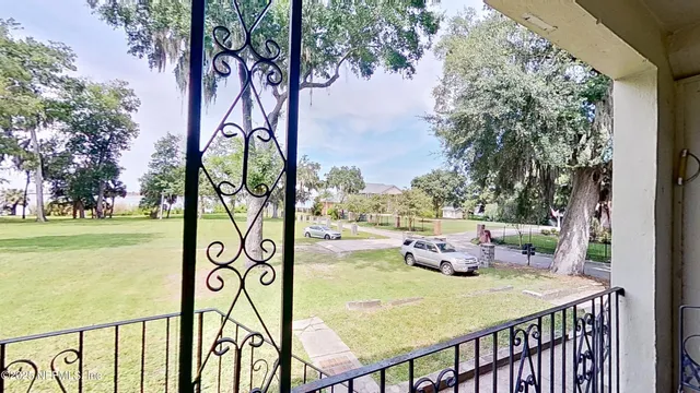 a view of a chairs and table in the patio