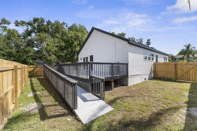 a view of balcony with deck and wooden floor