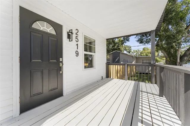 a view of a balcony with wooden floor