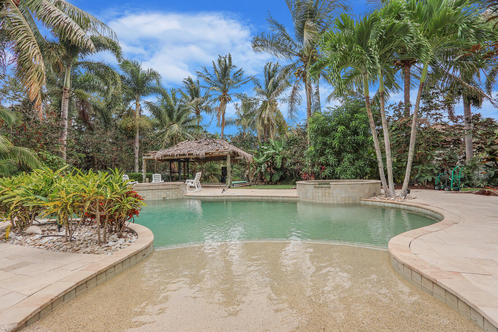 101 St Pierre Way Jupiter, FL 33458 - Photo 47 of 57 a view of a swimming pool with lounge chair