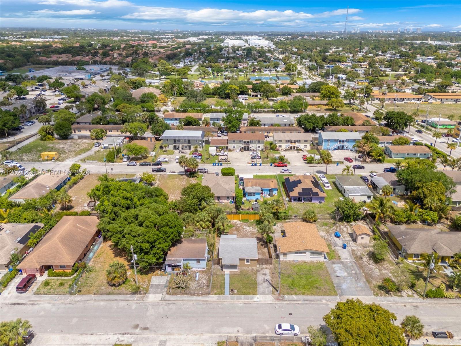 1660 West 26th Street Riviera Beach, FL 33404 - Photo 26 of 28 an aerial view of residential houses with outdoor space