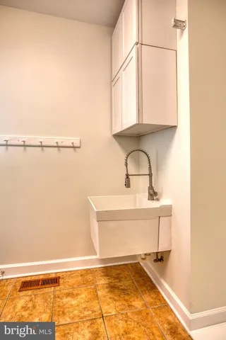 a living room with fireplace and a table