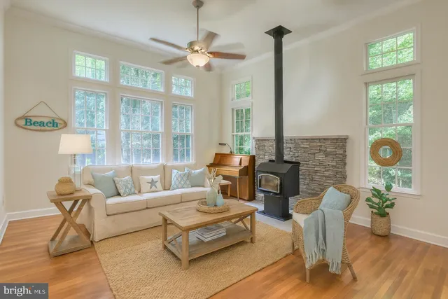 a large white bathroom with a double vanity sink a mirror and a bathtub