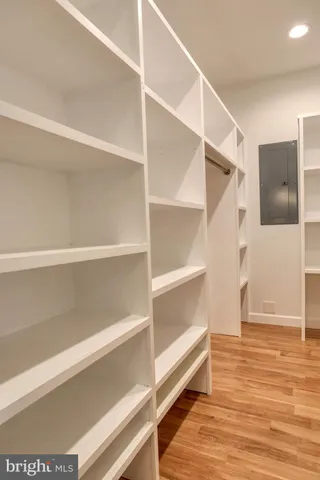 a living room with furniture a table and a large window