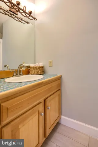 a bedroom with bed and a large window