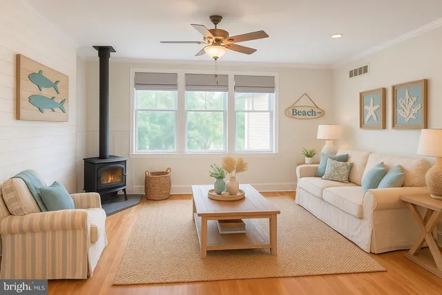 a view of a patio with table and chairs with wooden floor and fence