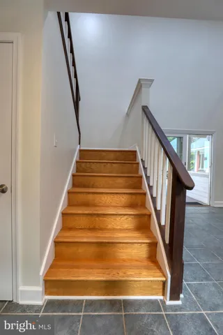 a patio with sofas table and chairs