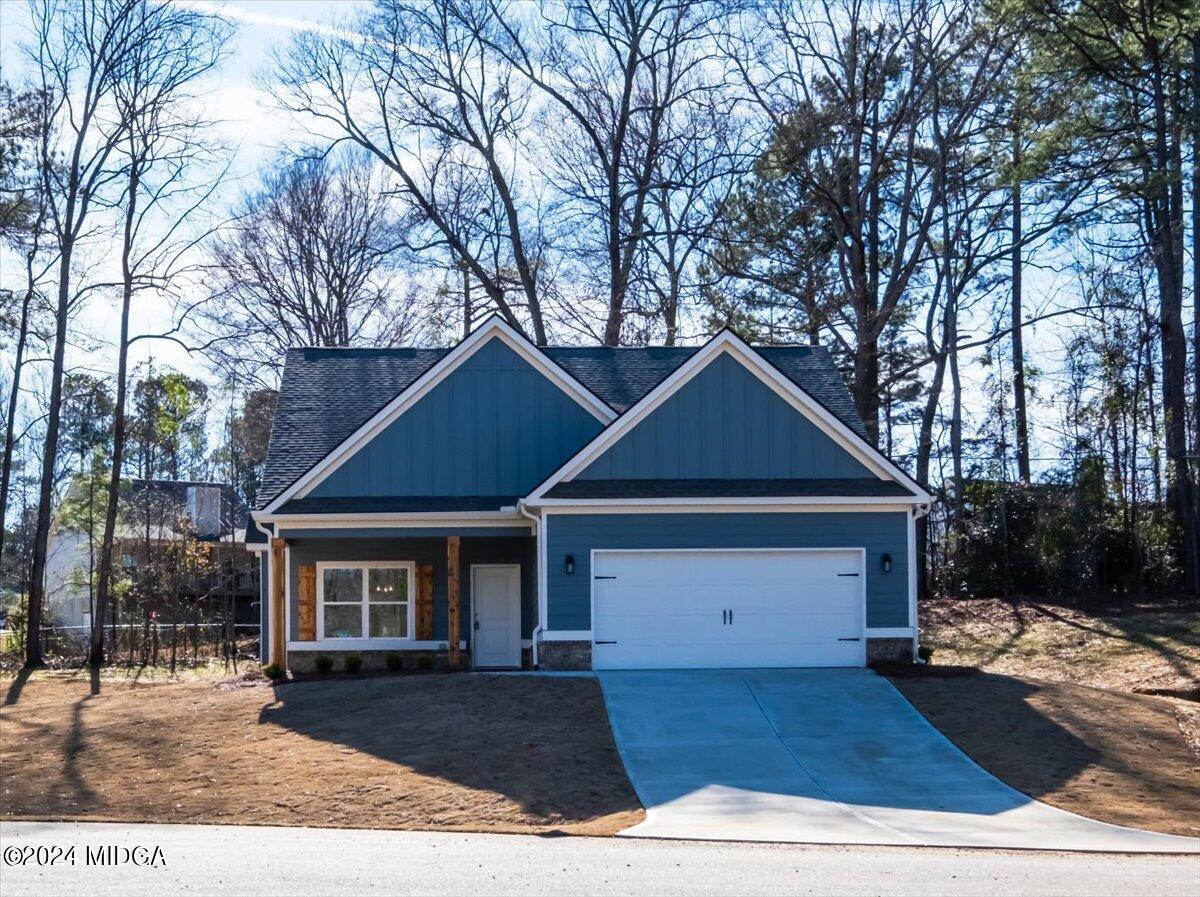 364 Walnut Grove Road Gray, GA 31032 - Photo 1 of 27 a front view of a house with a yard and garage