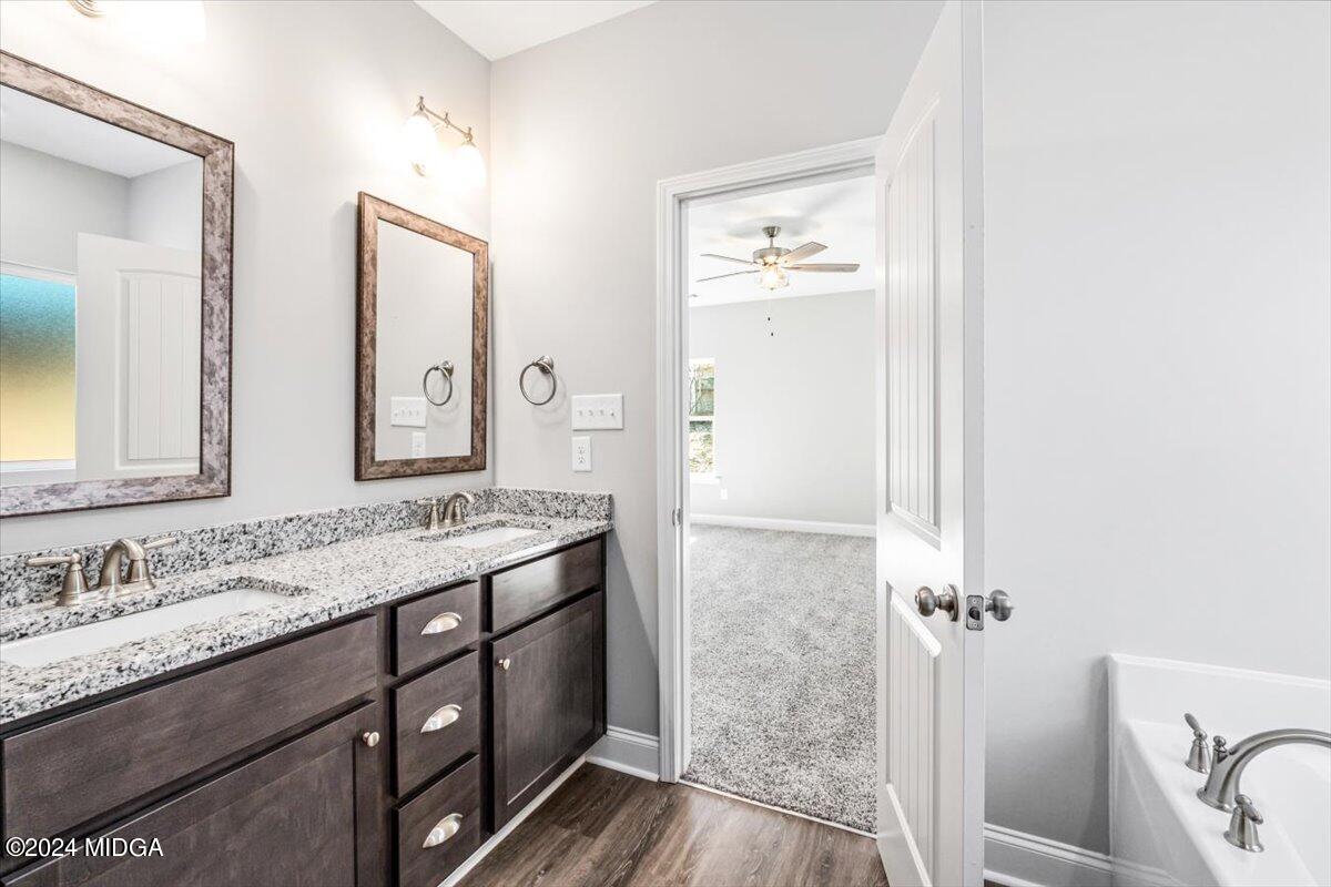364 Walnut Grove Road Gray, GA 31032 - Photo 15 of 27 a bathroom with a granite countertop sink mirror and a