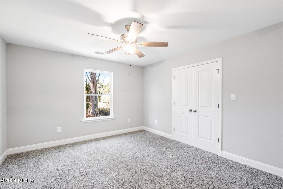 364 Walnut Grove Road Gray, GA 31032 - Photo 16 of 27 a view of an empty room with a window