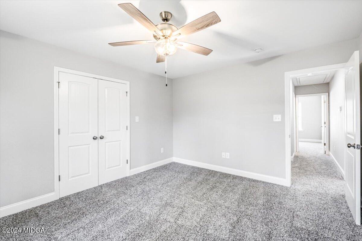 364 Walnut Grove Road Gray, GA 31032 - Photo 17 of 27 an empty room with chandelier fan