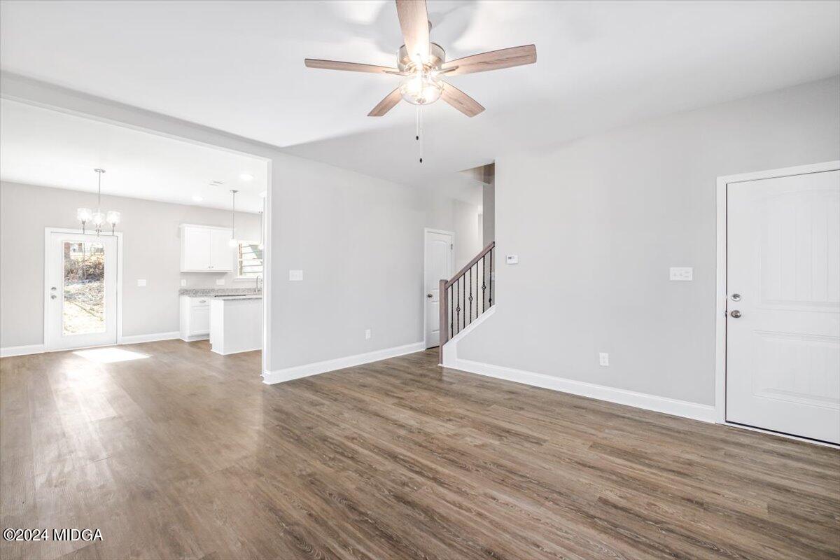 364 Walnut Grove Road Gray, GA 31032 - Photo 5 of 27 wooden floor in an empty room with a window