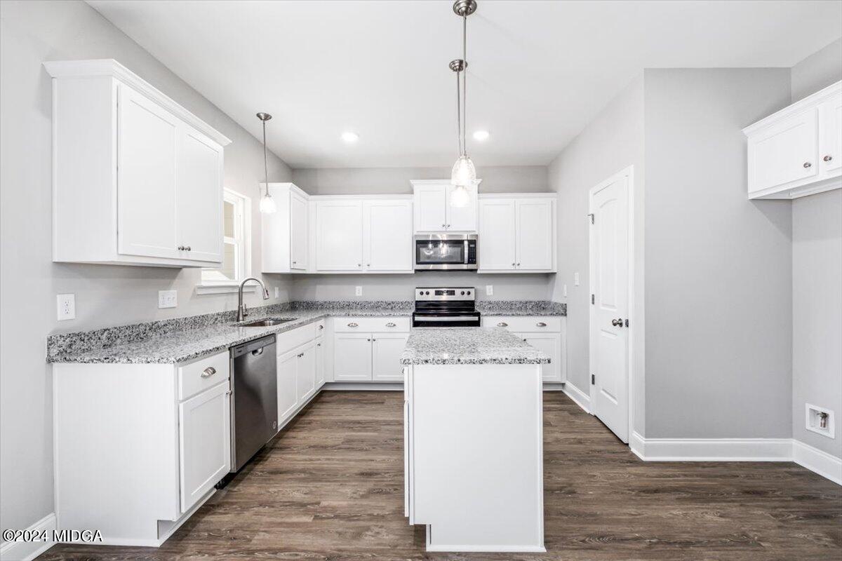 364 Walnut Grove Road Gray, GA 31032 - Photo 7 of 27 a kitchen with a stove sink and cabinets