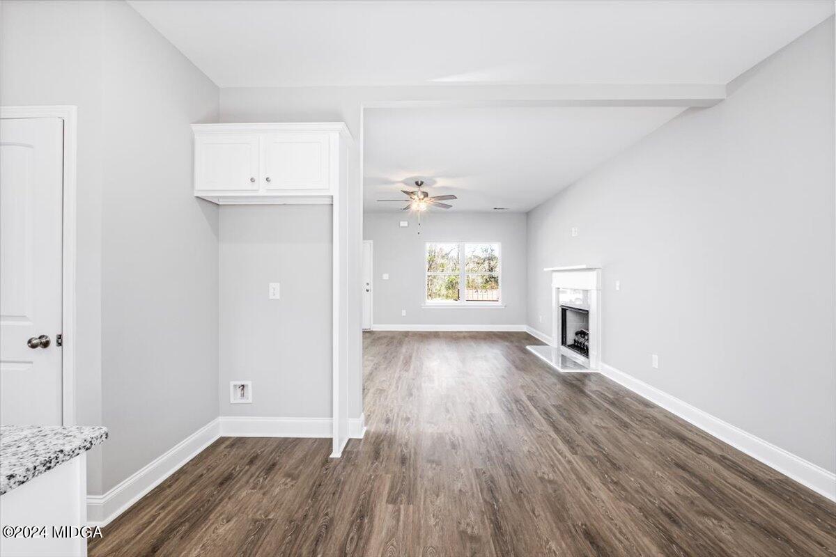 364 Walnut Grove Road Gray, GA 31032 - Photo 8 of 27 an empty room with wooden floor and windows