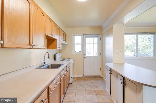a kitchen with refrigerator and countertop