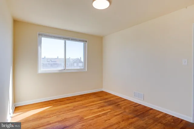 a bathroom with a sink toilet and a mirror