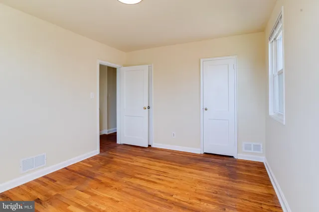 a bathroom with a bath tub with a shower