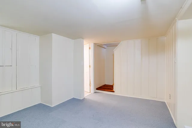 a view of a house with a yard and pathway