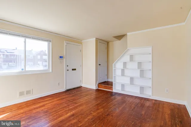 a view of a livingroom with wooden floor