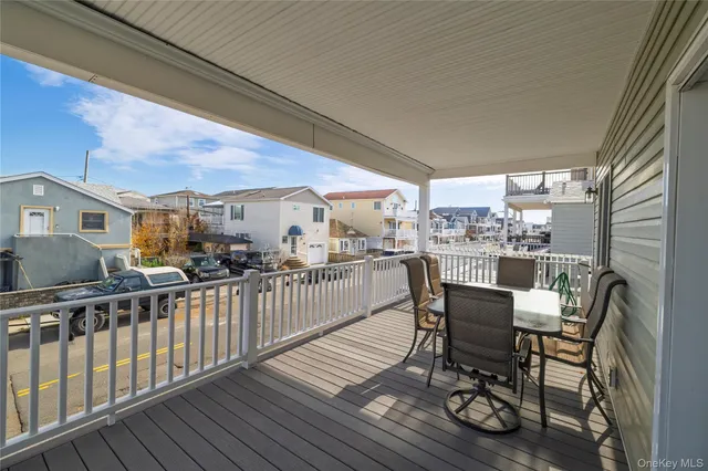 a view of a chairs and table in patio