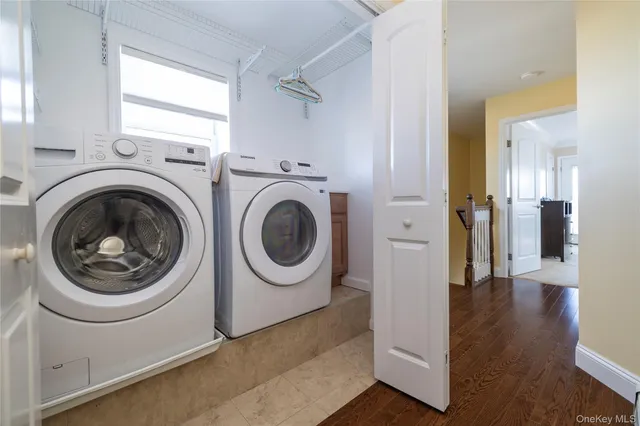 a view of a balcony with two chairs and a table