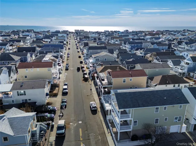 an aerial view of a building with parking space
