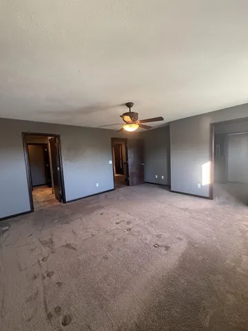 a spacious bathroom with a double vanity sink and a mirror
