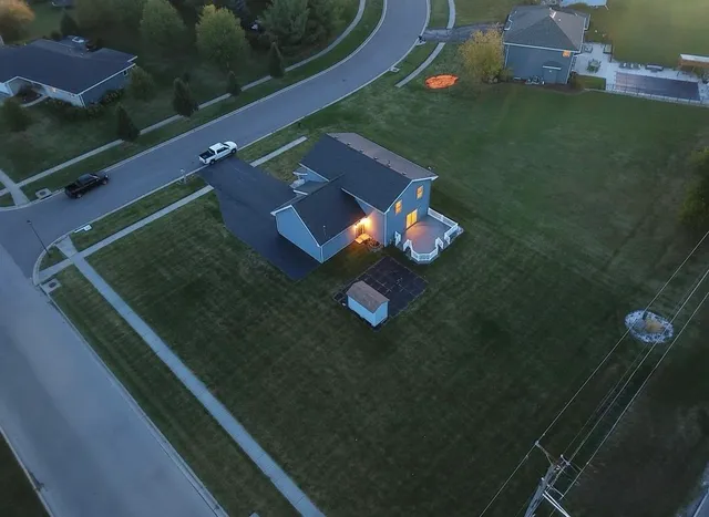 an aerial view of residential houses with outdoor space