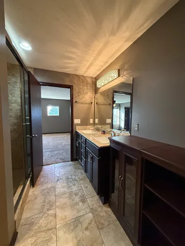 a view of an empty room with closet area