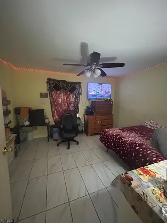 a bedroom with furniture and a lamp