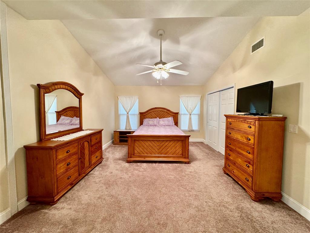 4301 Southwest 12th Way Okeechobee, FL 34974 - Photo 18 of 29 a living room with furniture and a flat screen tv