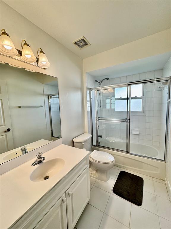 4301 Southwest 12th Way Okeechobee, FL 34974 - Photo 28 of 29 a bathroom with a sink a toilet and shower