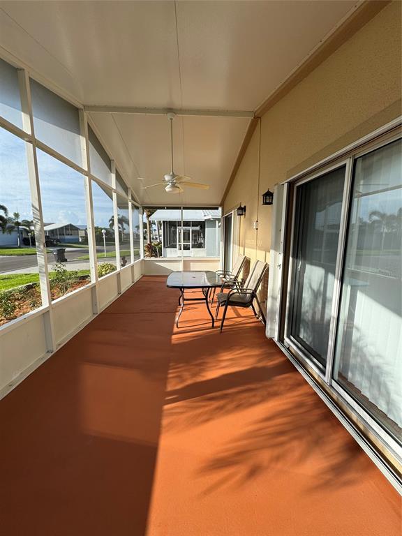 4301 Southwest 12th Way Okeechobee, FL 34974 - Photo 5 of 29 an empty room with wooden floor and windows