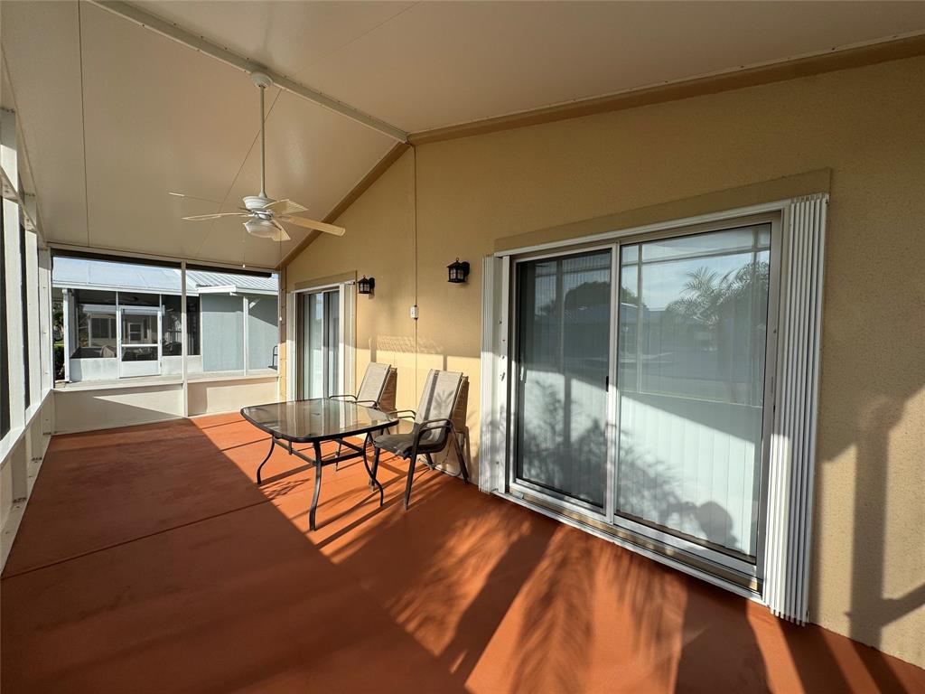 4301 Southwest 12th Way Okeechobee, FL 34974 - Photo 6 of 29 a patio with yard glass top table and chairs