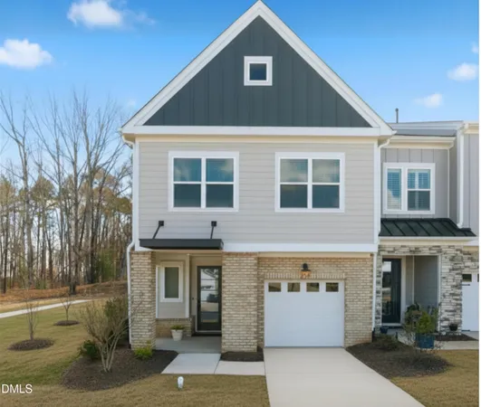 a front view of a house with a garage