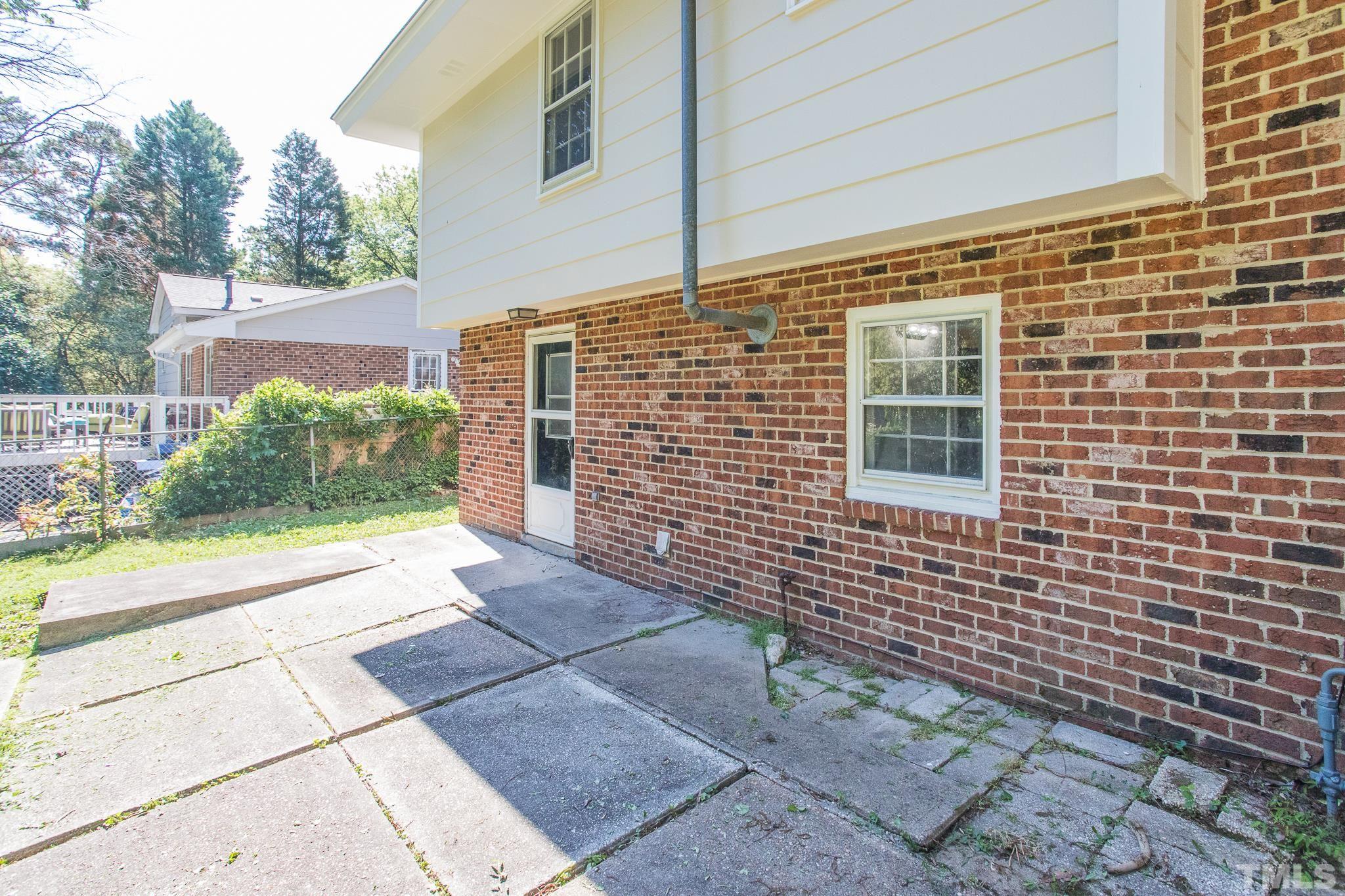3715 Tulane Drive Raleigh, NC 27604 - Photo 12 of 39 a view of a brick house with a yard