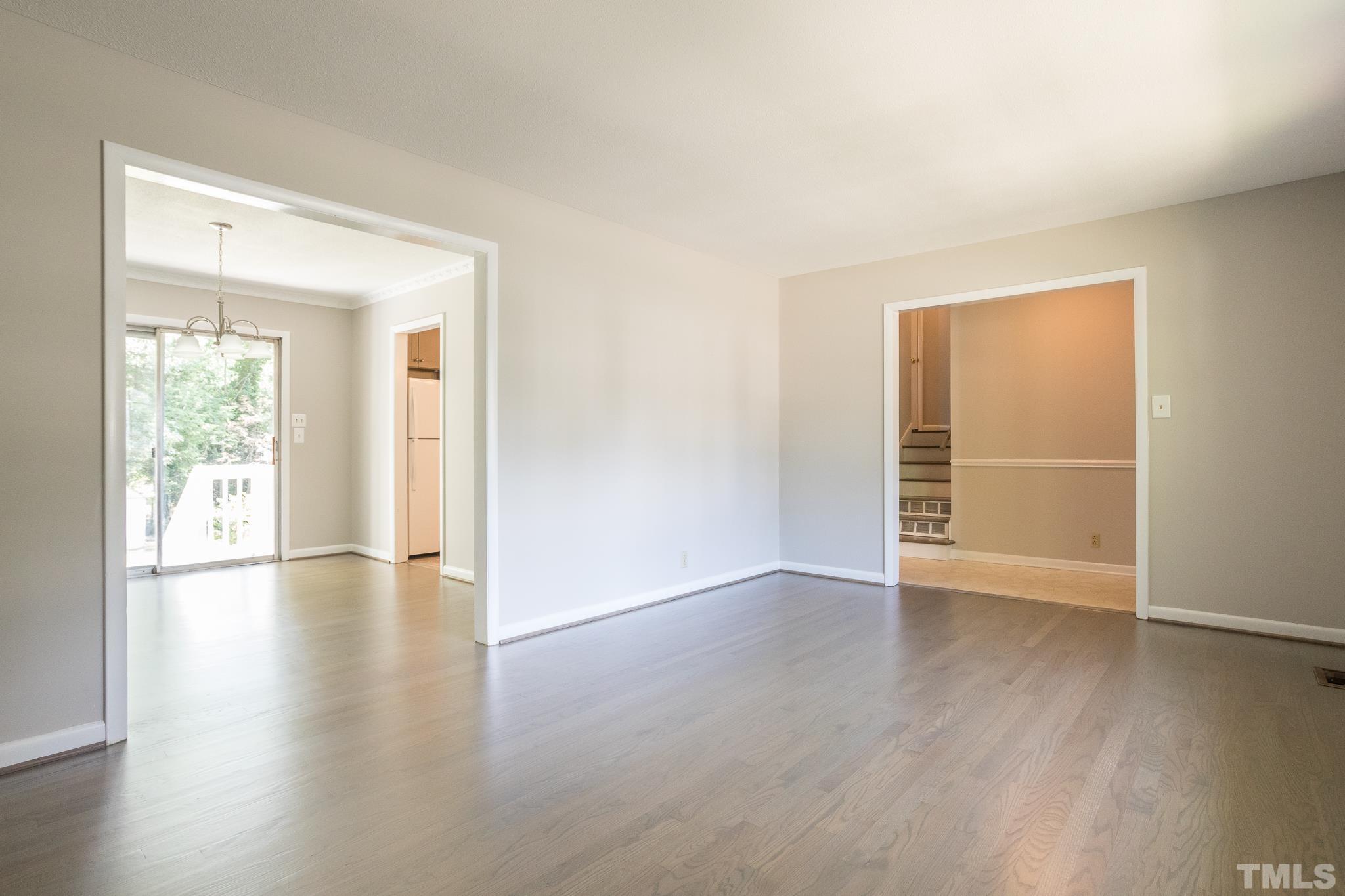 3715 Tulane Drive Raleigh, NC 27604 - Photo 16 of 39 an empty room with wooden floor and windows
