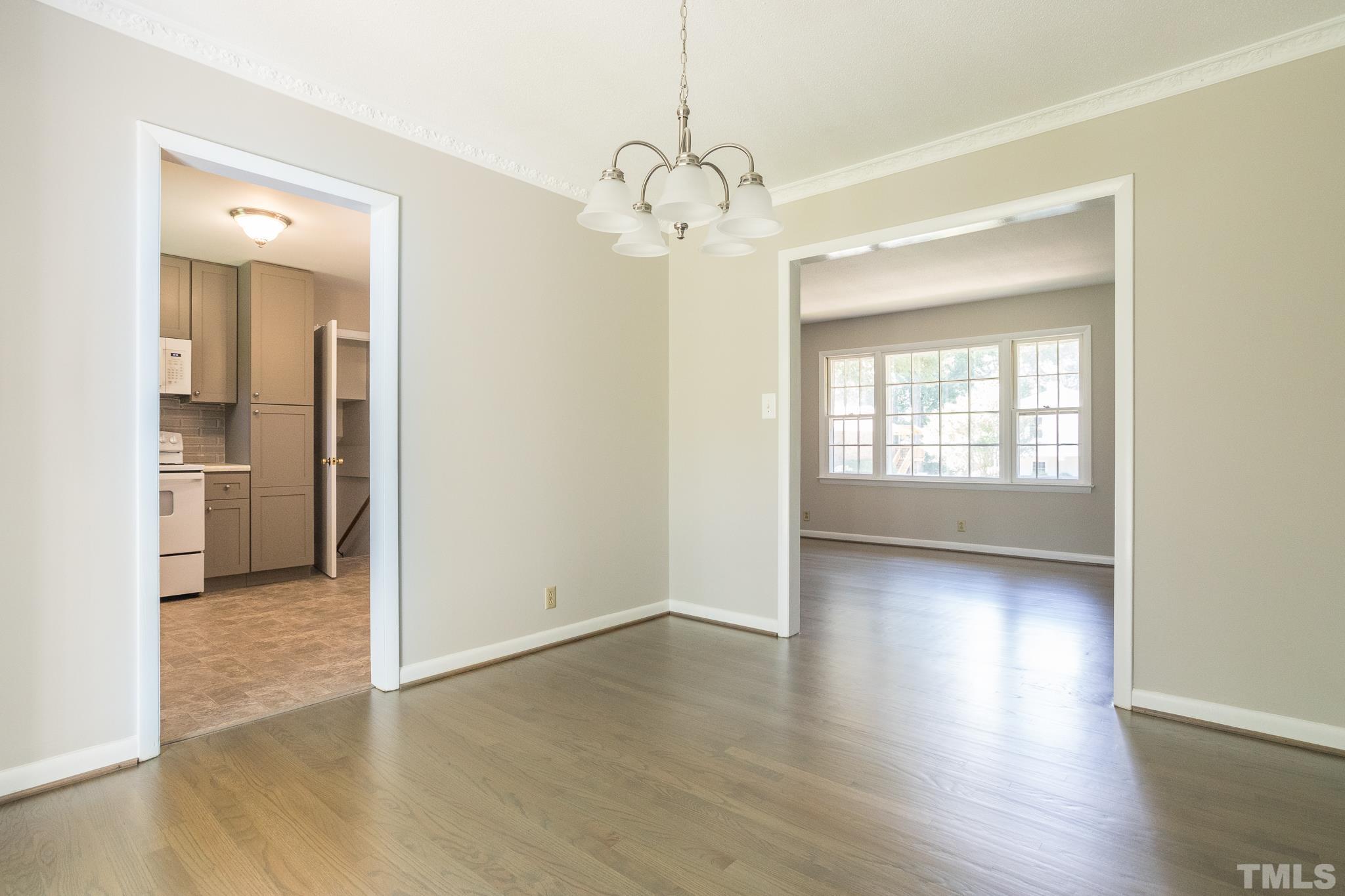 3715 Tulane Drive Raleigh, NC 27604 - Photo 19 of 39 wooden floor in an empty room with a window