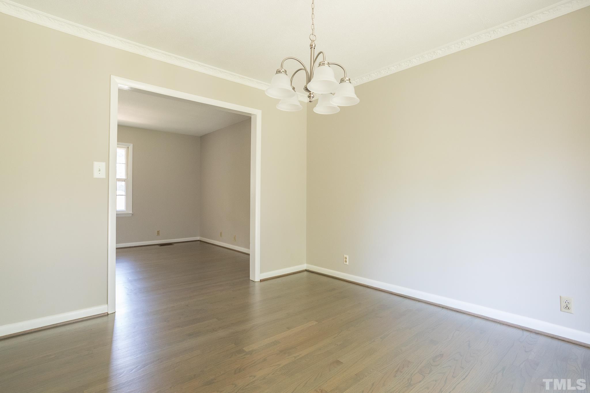 3715 Tulane Drive Raleigh, NC 27604 - Photo 20 of 39 an empty room with wooden floor and windows