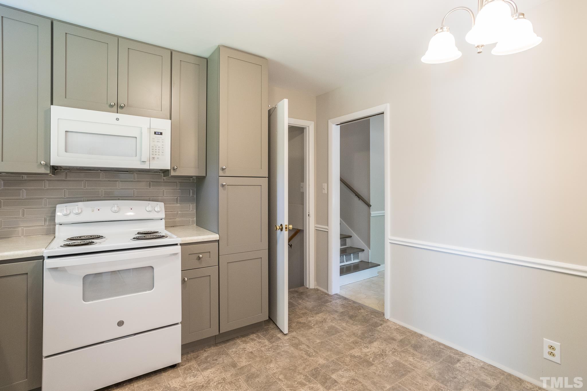 3715 Tulane Drive Raleigh, NC 27604 - Photo 21 of 39 a view of kitchen with refrigerator and cabinets